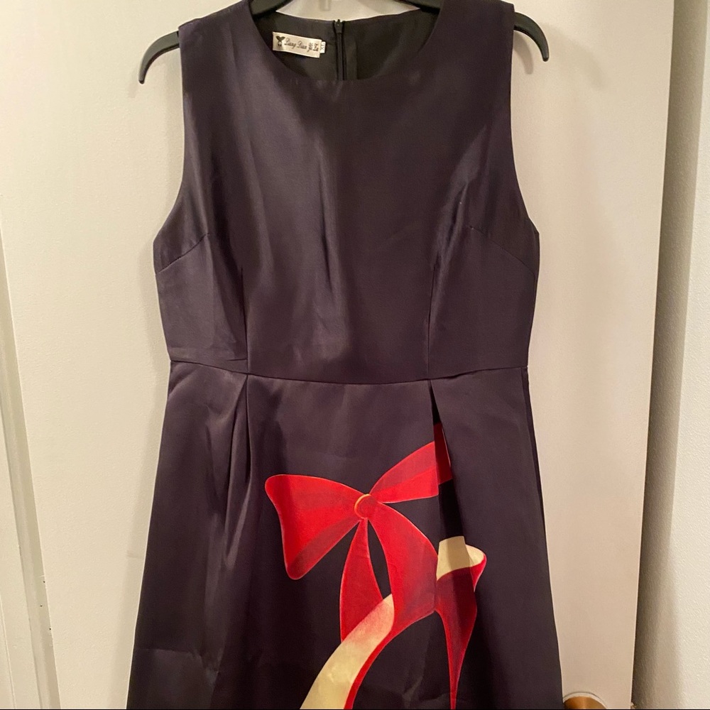 Black with red stiletto design on the front and back! Fits size 8 $25